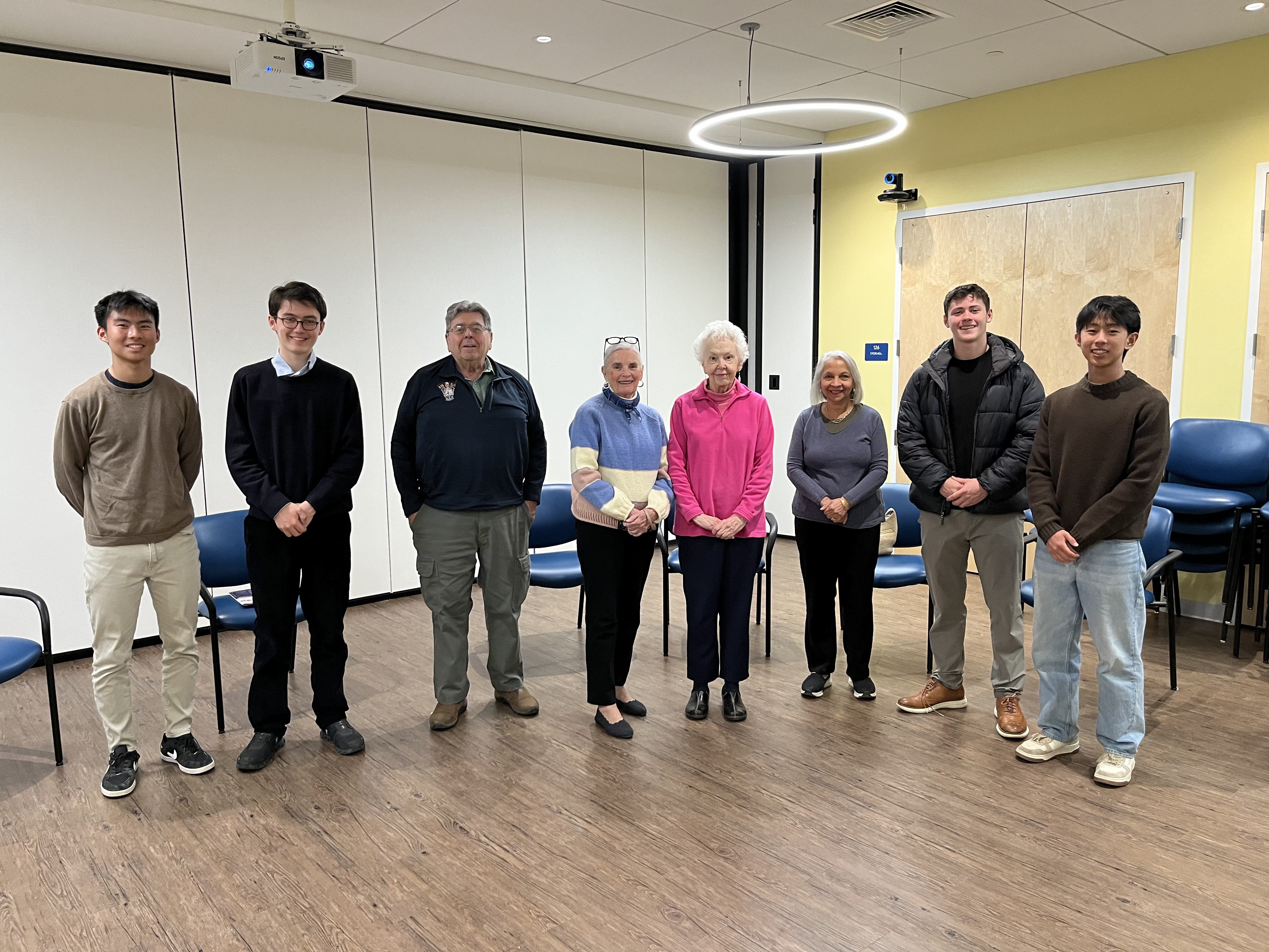 Seniors engaged in a philosophy discussion at a senior center